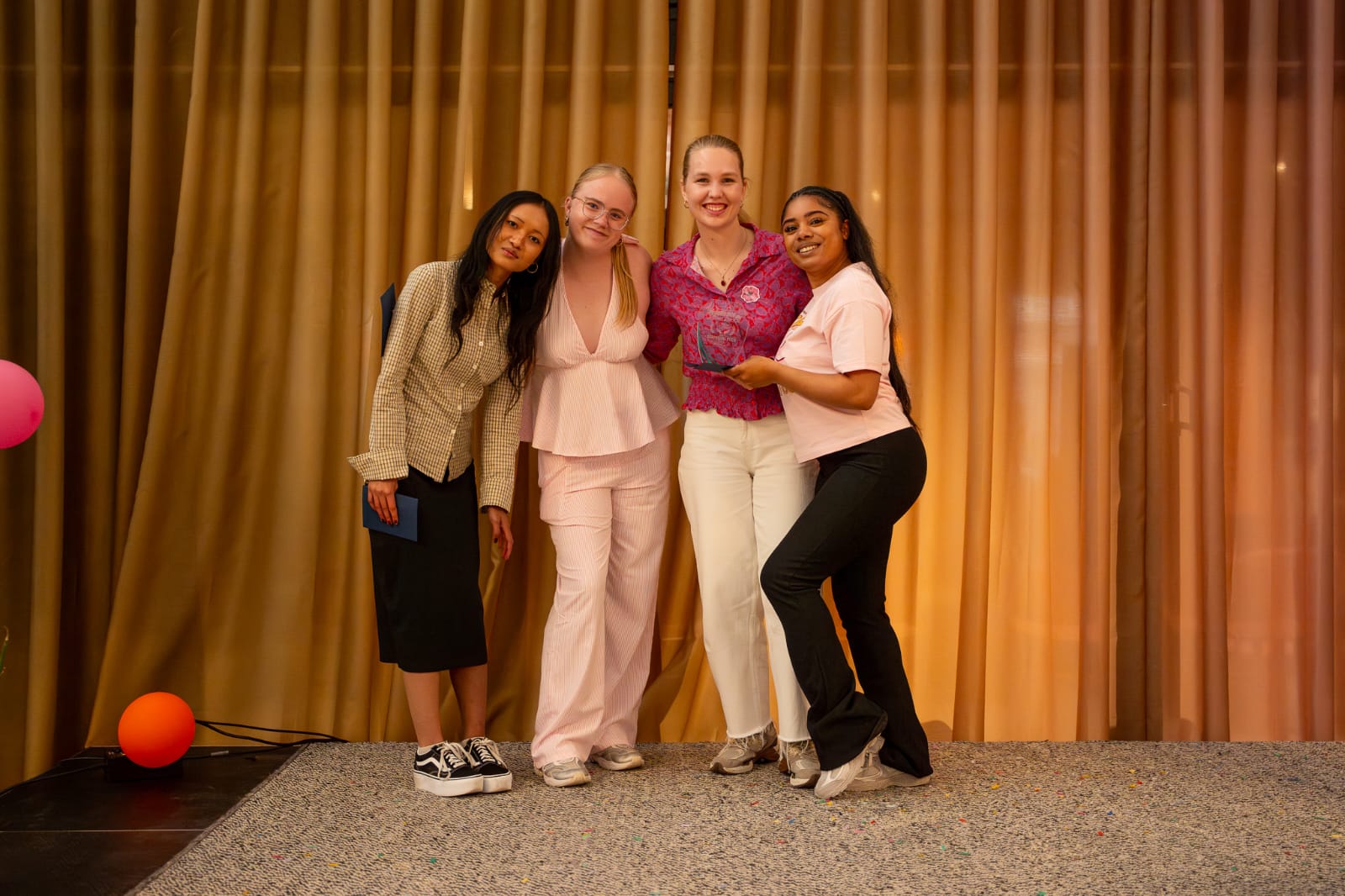 Four Future Design Studio team members together with their award