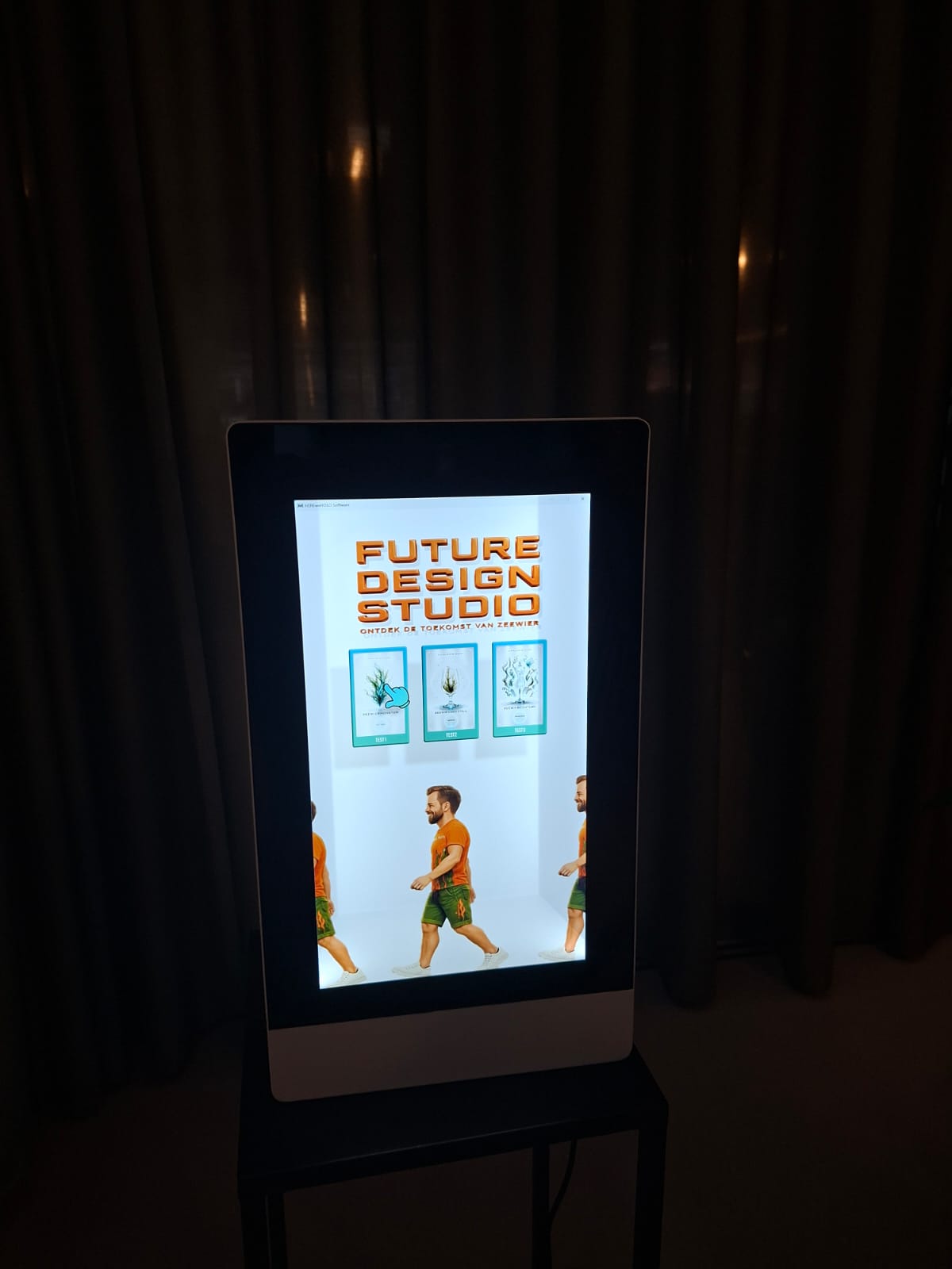Working full-scale holographic kiosk in a dark environment